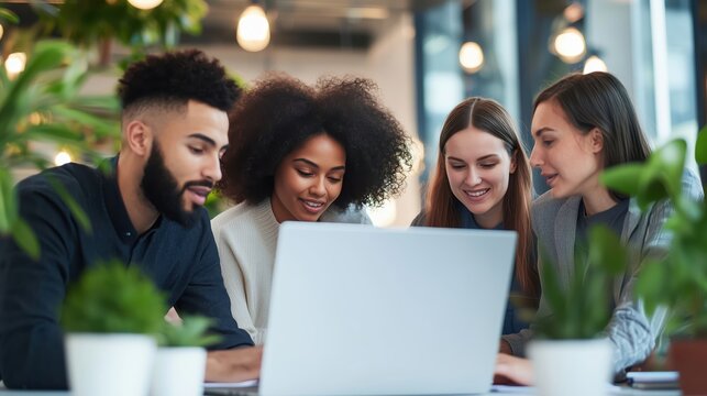 Diverse Team Collaborating on Project Ideas Around Laptop