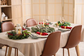 Dining table with beautiful setting for Christmas eve in room
