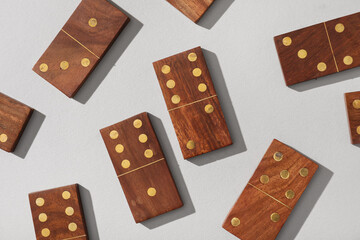 Wooden dominos blocks on grey background