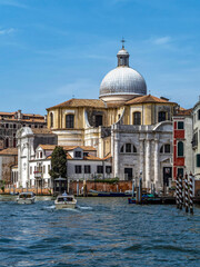 Naklejka premium Church of Santi Geremia e Lucia, by the Grand Canal in Venice, a remarkable example of Venetian architecture. The surrounding area includes historic buildings and the iconic canal.