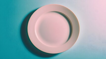 Minimalist white plate beautifully displayed on a vibrant blue background emphasizing simplicity and elegance