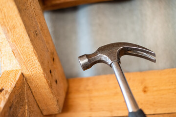 Hammer and wood, Steel Claw hammer on wooden boards, construction scene.