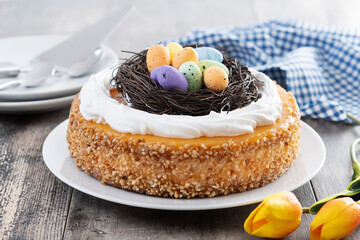 Homemade Easter egg cake on wooden table