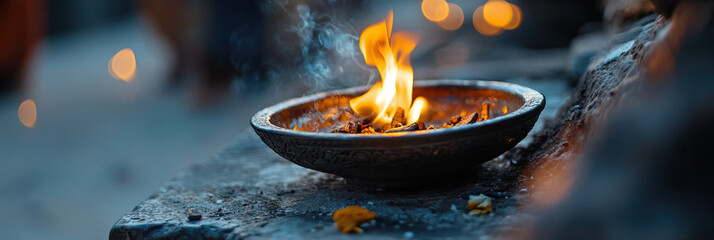 Burning Embers in Ornate Bowl on Stone Surface