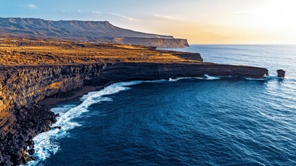 Obraz premium Dramatic Coastal Cliffs Golden Hour Ocean Waves Seascape