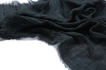 Fabric black napkin isolated on white background, closeup