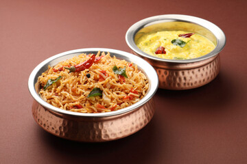 Tomato rice with mor kolumbu or kaddhi