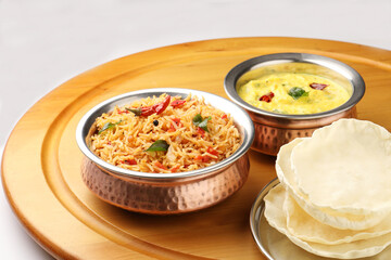 Tomato rice with mor kolumbu or kaddhi