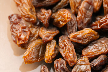 Raisins on a white background. Dried grapes.