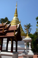 Fototapeta premium Ancient chedi or antique old stupa for thai people travelers travel visit and respect praying blessing wish holy mystery of Wat Phra Kaew or Pa Ya or Pa Yea temple at Chiangrai in Chiang Rai, Thailand