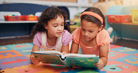 Girls, reading book and friends on ground, school and learning with education, growth and literacy...