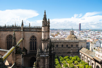 Naklejka premium Cityscape view of the city of Seville, Spain taken from the La Giralda tower and spire at Seville cathedral.