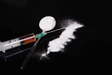 Syringe with drugs dose on black background. Narcotic substances in spoon. Drugs concept on dark place. addiction and bad habits. Heroin narcotic crime. Danger addict problem criminal