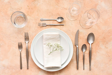 Stylish table setting on beige background. Top view