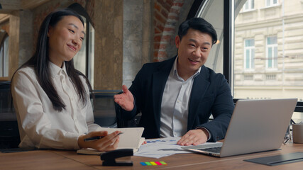Two Asian business colleagues Korean coworkers Chinese adult middle-aged man businessman Japanese...