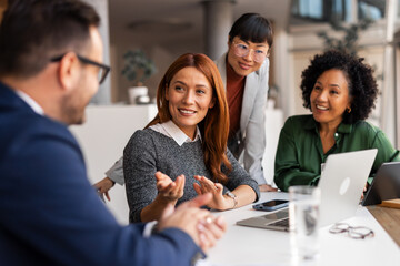 Professional Team Engaged in Creative Office Discussion