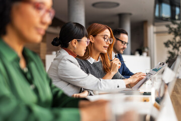 Group of Colleagues Collaborating in a Bright Office Environment