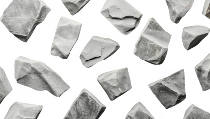 irregularly shaped gray stones arranged on a light background showcasing their natural textures and forms ideal for use in design art or as decorative elements