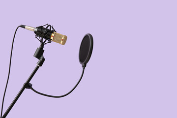 Stand with professional microphone on light background