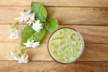Ice matcha green tea with milk and white jasmine flowers