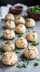 Obraz premium Delicious Baked Potato Balls with Sesame Seeds and Parsley
