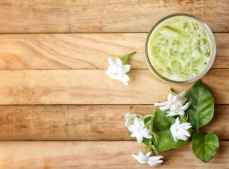 Ice matcha green tea with milk and white jasmine flowers