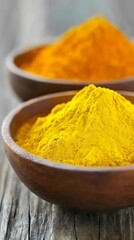 Vibrant Turmeric and Paprika Powder in Wooden Bowls