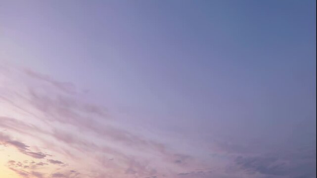 Wide gradient evening sky with fading sunlight and gentle pastel tones in serene open atmosphere. Concept of peace, clarity and natural beauty