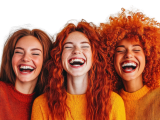 Three women laughing joyfully together