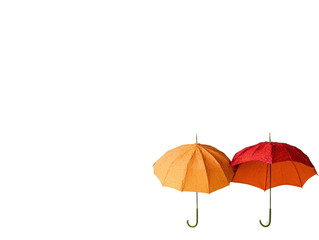 Two colorful umbrellas on white background
