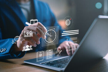 Business professional working on a laptop with clock and to do list interface, time management and...