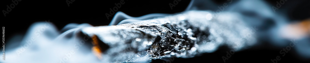 Poster close-up of smoldering object with smoke