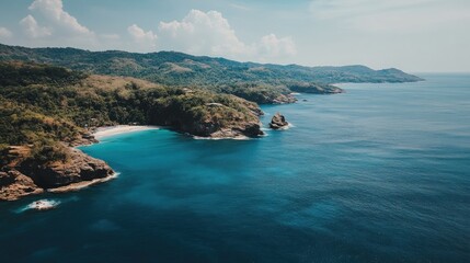 Fototapeta premium Breathtaking Aerial view of tropical beach coast in exotic pristine ocean