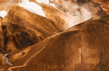 Kerlingarfjoll volcanic mountain range on geothermal area and sulphur smoke in summer at Highlands...