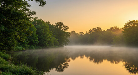 Tranquil Sunrise Over Misty Lake with Reflection