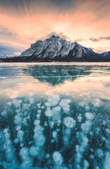 View of Abraham Lake with natural bubbles frost in the morning on winter at Banff national park