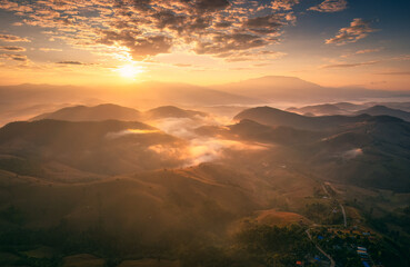 Golden sunrise over Doi Inthanon and foggy hill in harvest season at Chiang Mai