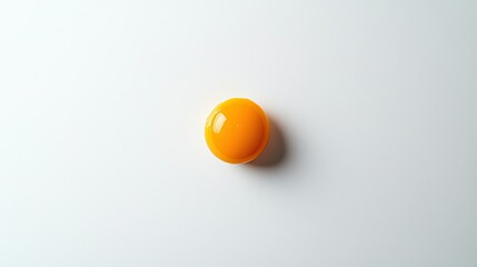 A freshly fried egg with a golden yolk, placed at the center of a clean white background.