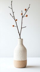 Vase with autumnal branch