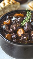 Fototapeta premium Rich Beef Stew with Carrots and Thyme in a Bowl