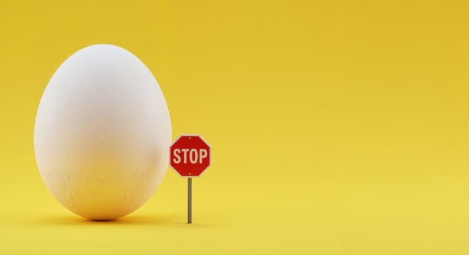 White egg with a stop sign as a symbol of egg allergy awareness on place for text   yellow background 