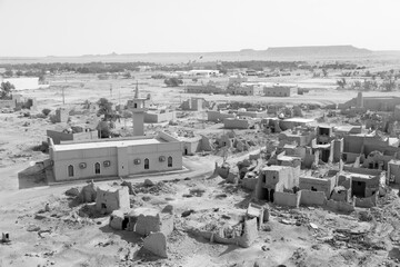 View of the small village Raghba with the abandoned mud houses in the middle of the desert in Saudi Arabia