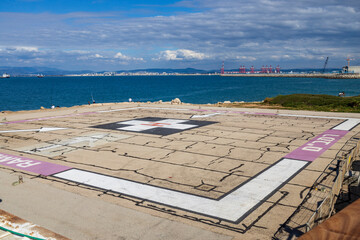 Haifa, Israel, March 21, 2025. Seaside helipad with a windsock and worn-out pavement near Rambam...