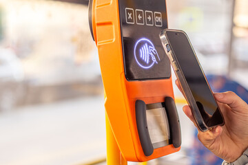 Paying for public transport by card. Public transport. Contactless fare payment.