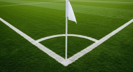 Fototapeta premium A corner of a soccer field showing the white lines and a white flag on the green grass field