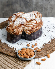 Colomba - Italian traditional Easter bread is topped with pearl sugar and almonds in the shape of a dove. Festive pastries are traditional in Italy.