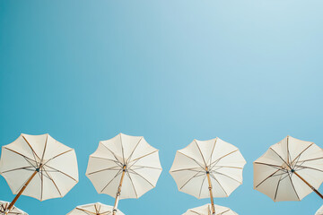 High Resolution Visual of Low Angle View of Parasols Against Clear Blue Sky