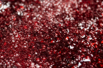 Crumpled sweet raspberries with added sugar