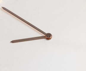 the white dial of the wristwatch with two hands