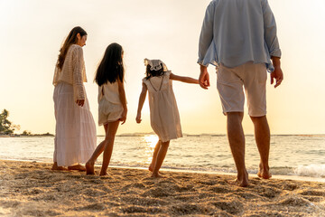 Happy family beach vacations.Group of multi generation family little girl with parents and...